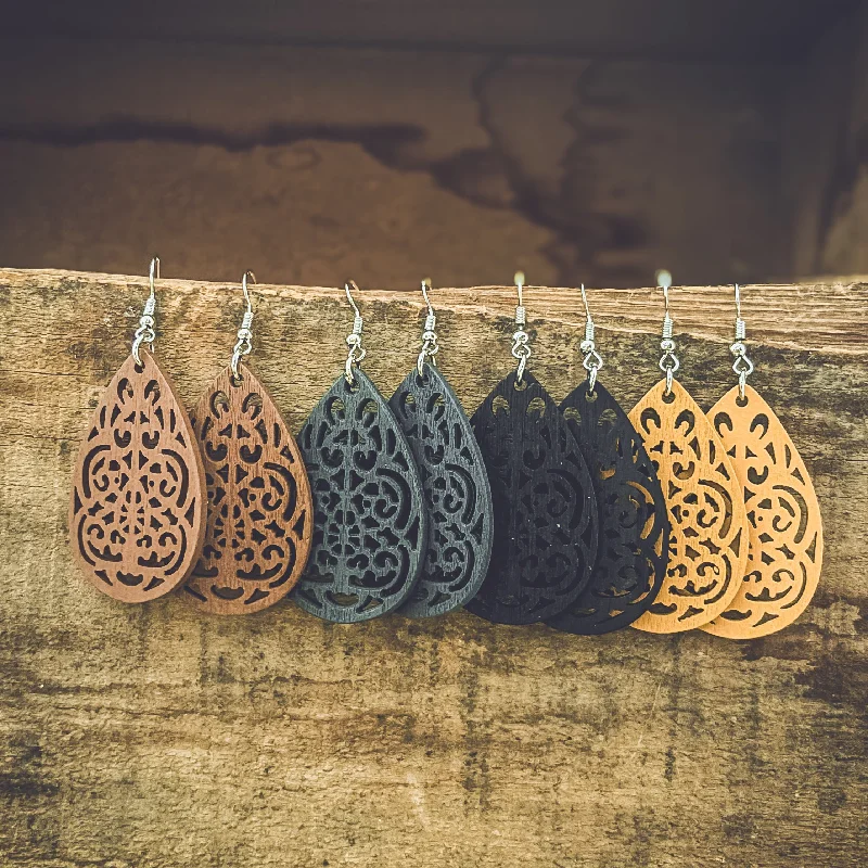 Best hoop earrings with crescent-shaped designs for a bold, moon-inspired style-Set of Four Beautiful Carved Wood Earrings