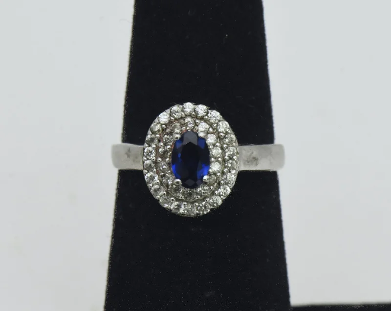 Platinum rings with sparkling sapphire center stones -Vintage Sterling Silver Imitation Sapphire Halo Ring - Size 5